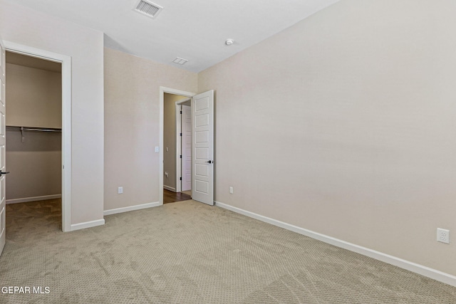 14904 John Mcneely Ave, El Paso, TX 79938 - unfurnished bedroom featuring carpet, a spacious closet, and a closet