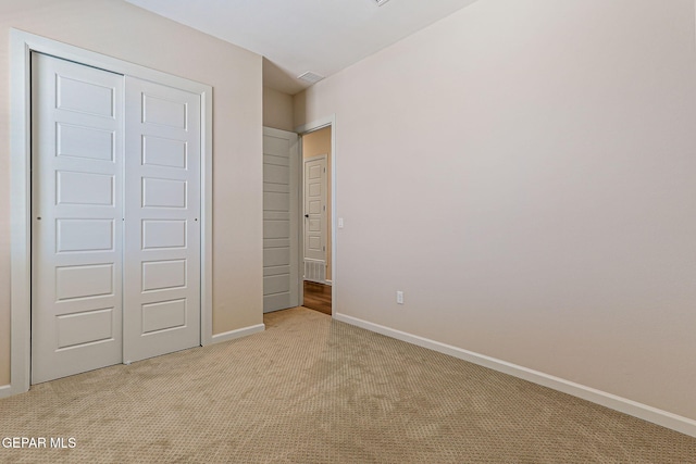 14904 John Mcneely Ave, El Paso, TX 79938 - unfurnished bedroom featuring light colored carpet and a closet