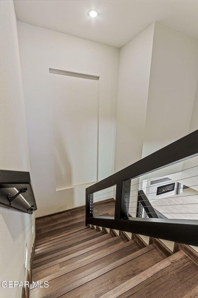 14904 John Mcneely Ave, El Paso, TX 79938 - staircase with wood finished floors and recessed lighting