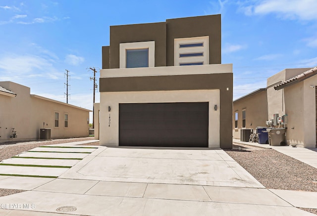 14904 John Mcneely Ave, El Paso, TX 79938 - view of front of house with stucco siding, an attached garage, and concrete driveway
