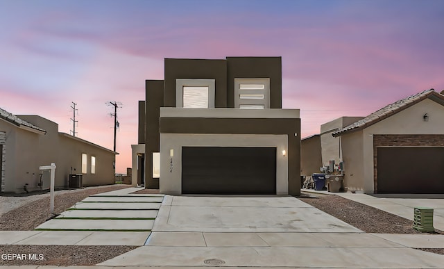 14904 John Mcneely Ave, El Paso, TX 79938 - modern home with concrete driveway, stucco siding, and a garage