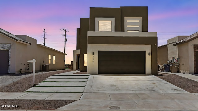 14904 John Mcneely Ave, El Paso, TX 79938 - contemporary home with driveway, stucco siding, and an attached garage