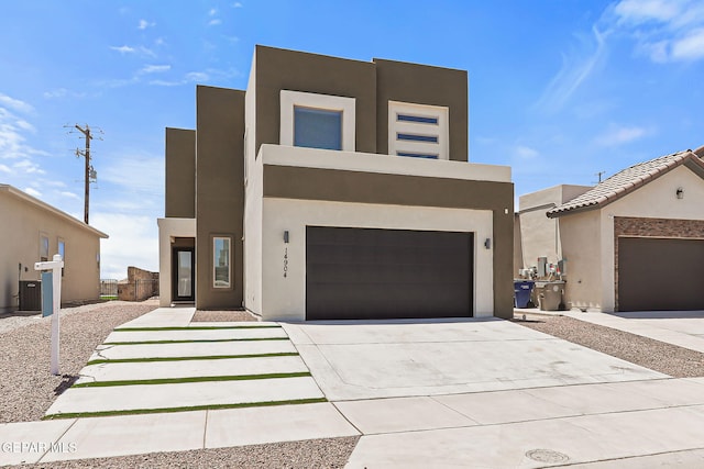 14904 John Mcneely Ave, El Paso, TX 79938 - modern home with stucco siding, driveway, and an attached garage