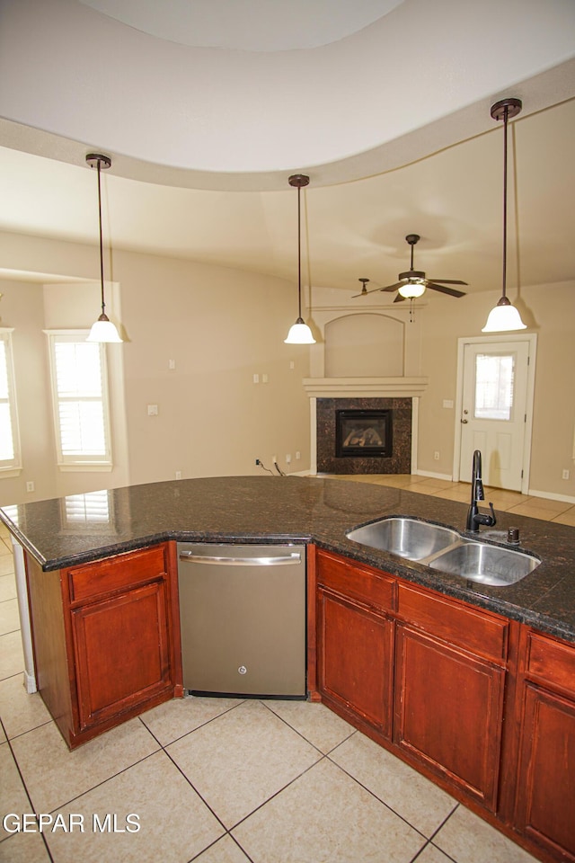 5353 Manuel Puentes Ct, El Paso, TX 79934 - kitchen featuring stainless steel dishwasher, open floor plan, a ceiling fan, and light tile patterned floors