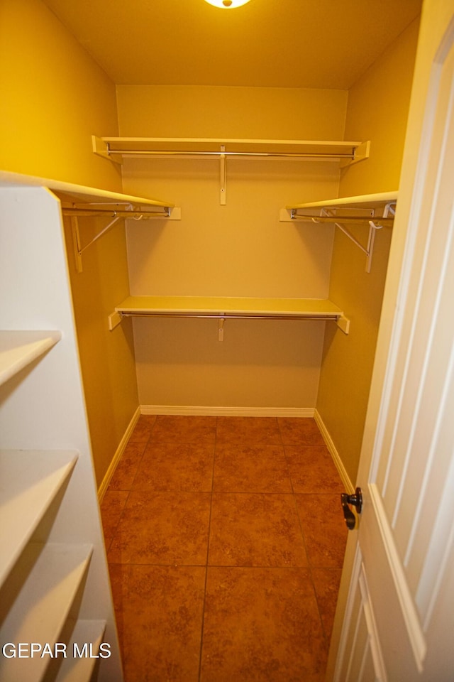 5353 Manuel Puentes Ct, El Paso, TX 79934 - spacious closet with tile patterned flooring