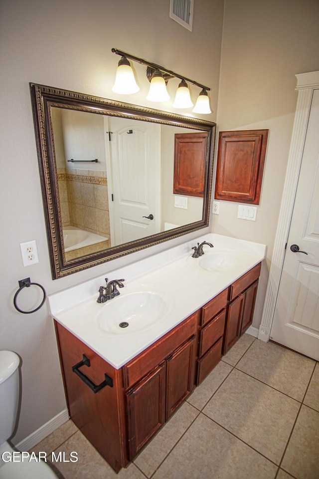 5353 Manuel Puentes Ct, El Paso, TX 79934 - full bath with double vanity and tile patterned flooring