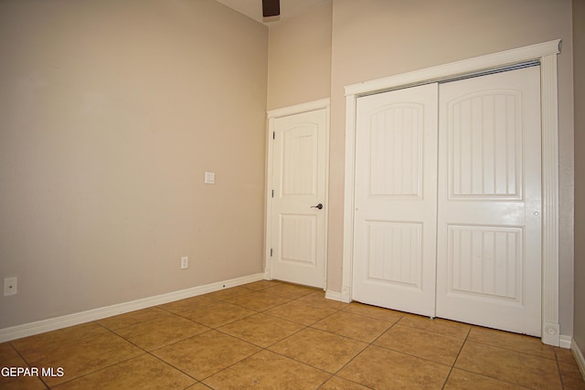 5353 Manuel Puentes Ct, El Paso, TX 79934 - unfurnished bedroom featuring light tile patterned floors and a closet