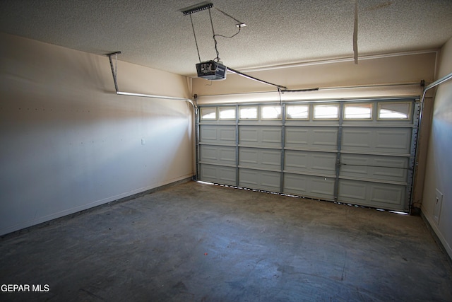 5353 Manuel Puentes Ct, El Paso, TX 79934 - garage featuring a garage door opener and baseboards
