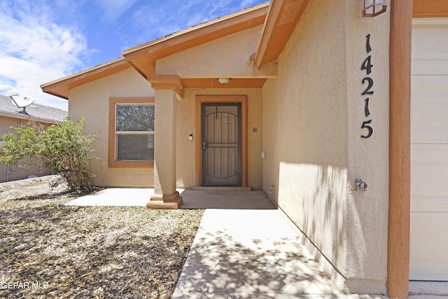 14215 Otter Point Ct, El Paso, TX 79938 - view of exterior entry featuring stucco siding