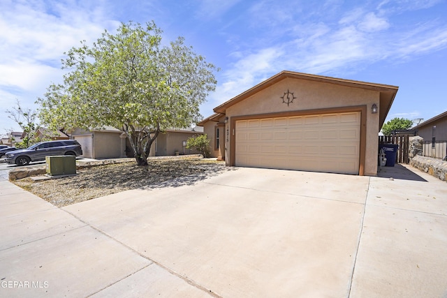 14215 Otter Point Ct, El Paso, TX 79938 - view of front of property with stucco siding, concrete driveway, and a garage