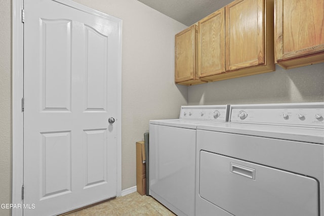 14215 Otter Point Ct, El Paso, TX 79938 - laundry room with cabinet space and separate washer and dryer