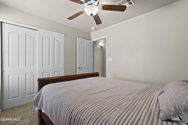 14215 Otter Point Ct, El Paso, TX 79938 - bedroom featuring a textured wall, a closet, carpet, and ceiling fan