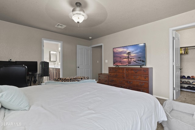 14215 Otter Point Ct, El Paso, TX 79938 - carpeted bedroom featuring connected bathroom and ceiling fan