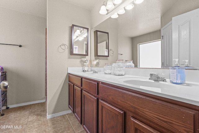 14215 Otter Point Ct, El Paso, TX 79938 - full bathroom with double vanity and tile patterned flooring