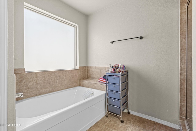 14215 Otter Point Ct, El Paso, TX 79938 - full bathroom with a garden tub and tile patterned floors