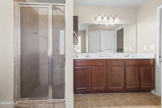 14215 Otter Point Ct, El Paso, TX 79938 - bathroom with a shower stall, double vanity, and tile patterned flooring