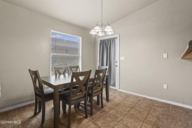14215 Otter Point Ct, El Paso, TX 79938 - dining room featuring a chandelier, tile patterned floors, and a textured wall