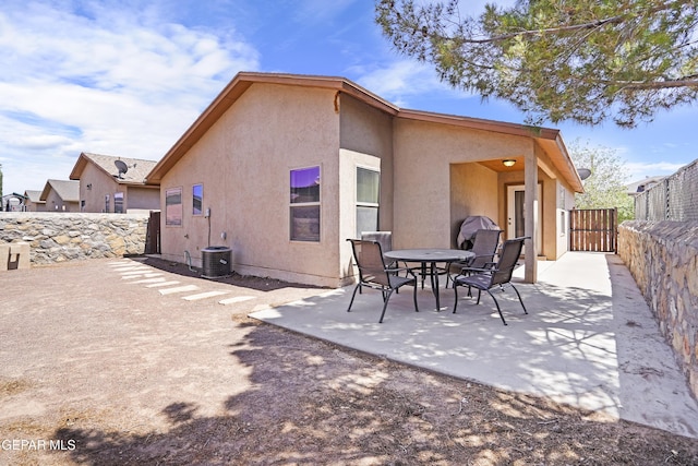 14215 Otter Point Ct, El Paso, TX 79938 - back of property featuring stucco siding, a fenced backyard, and a patio