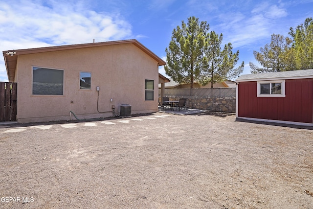 14215 Otter Point Ct, El Paso, TX 79938 - back of property with an outdoor structure, a patio area, and stucco siding