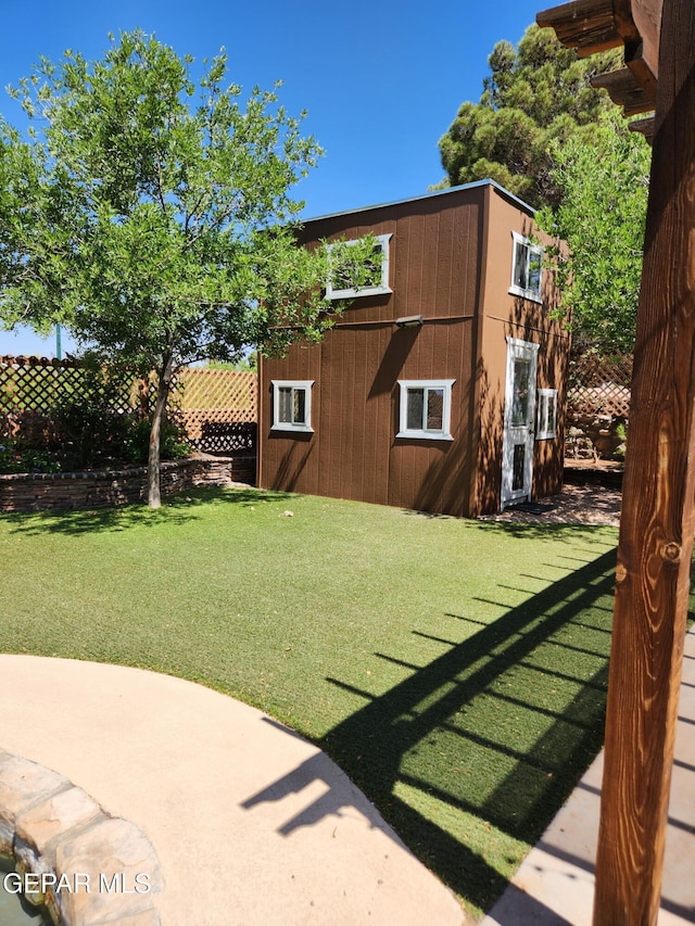 1409 Rainbow Ridge Dr, El Paso, TX 79912 - view of yard with an outbuilding