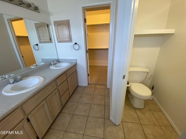 1409 Rainbow Ridge Dr, El Paso, TX 79912 - full bathroom featuring double vanity, a spacious closet, and tile patterned floors