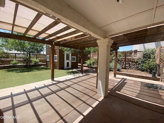 1409 Rainbow Ridge Dr, El Paso, TX 79912 - fenced backyard featuring an outbuilding and a patio