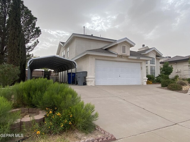 1409 Rainbow Ridge Dr, El Paso, TX 79912 - view of front of property with stucco siding, concrete driveway, a carport, and a garage