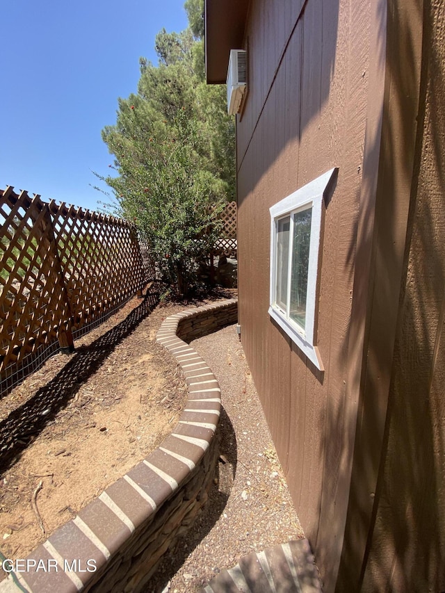 1409 Rainbow Ridge Dr, El Paso, TX 79912 - view of property exterior with a wall mounted air conditioner
