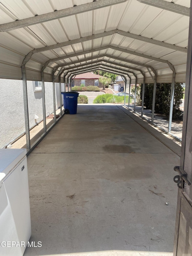 1409 Rainbow Ridge Dr, El Paso, TX 79912 - view of parking featuring a detached carport