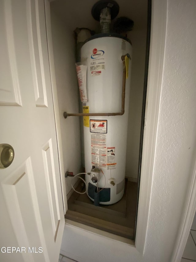 1409 Rainbow Ridge Dr, El Paso, TX 79912 - utility room featuring gas water heater