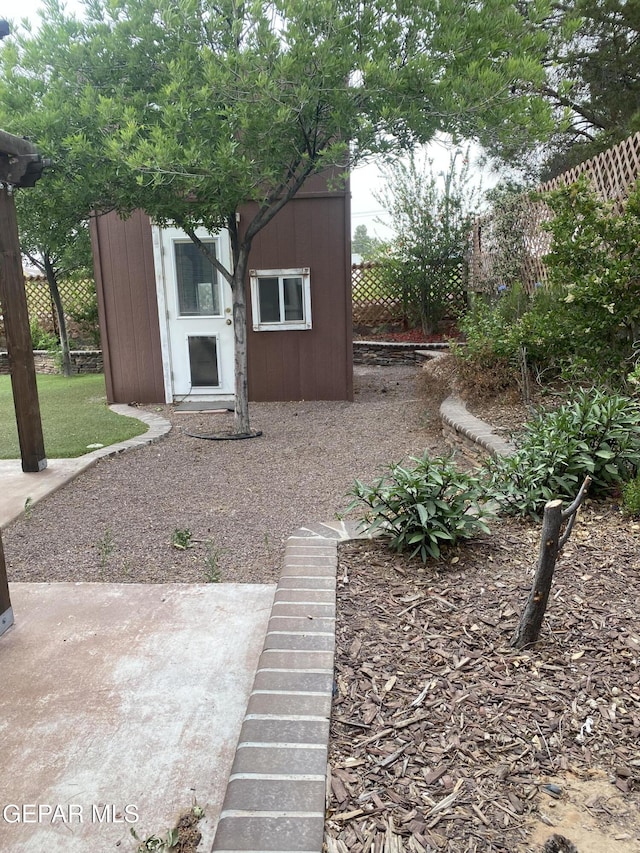 1409 Rainbow Ridge Dr, El Paso, TX 79912 - view of yard with an outbuilding