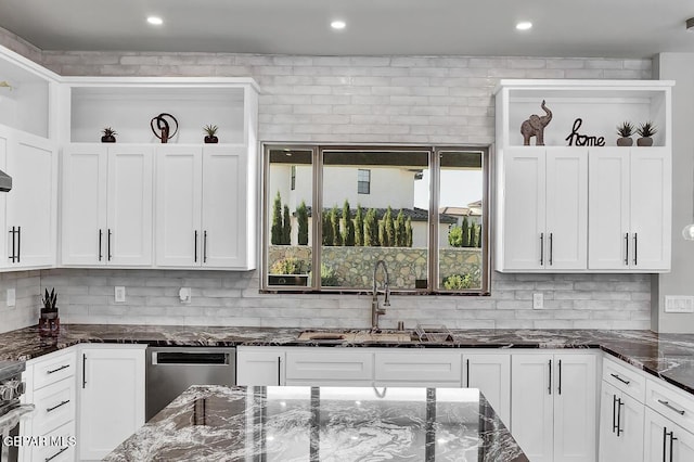 525 Cotton Blossom Ave, El Paso, TX 79922 - kitchen with white cabinetry, tasteful backsplash, dark stone countertops, and recessed lighting