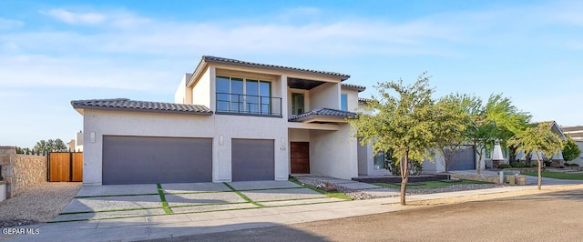 525 Cotton Blossom Ave, El Paso, TX 79922 - mediterranean / spanish home with driveway, stucco siding, a tiled roof, and a garage