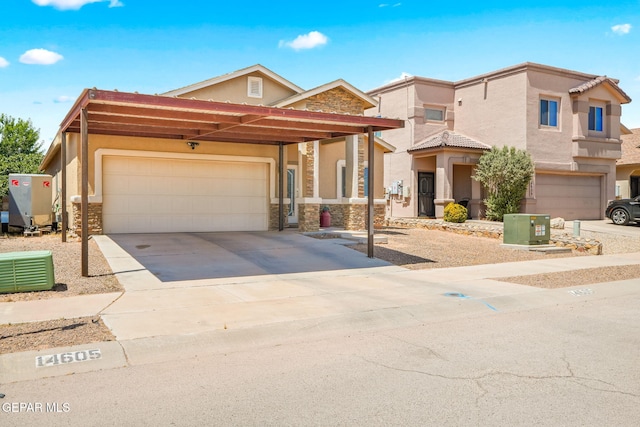 14605 Spanish Point Dr, El Paso, TX 79938 - view of front of home featuring stone siding, stucco siding, driveway, and a garage