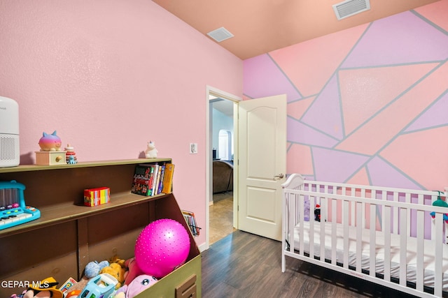 14605 Spanish Point Dr, El Paso, TX 79938 - bedroom with wood finished floors and a nursery area