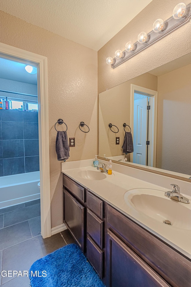12355 Joe Gomez, El Paso, TX 79928 - bathroom with double vanity, tile patterned floors, and tub / shower combination