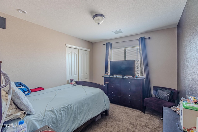 12355 Joe Gomez, El Paso, TX 79928 - carpeted bedroom featuring a closet, a textured ceiling, and a textured wall