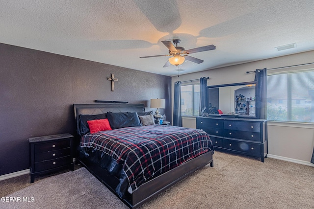 12355 Joe Gomez, El Paso, TX 79928 - carpeted bedroom with a textured ceiling, a ceiling fan, and a textured wall