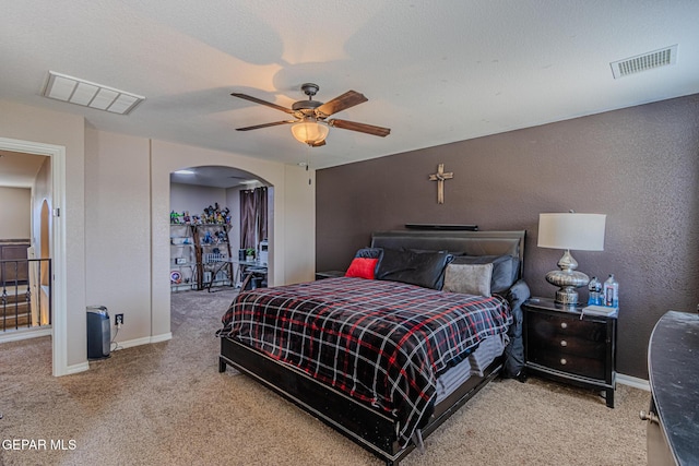 12355 Joe Gomez, El Paso, TX 79928 - bedroom with arched walkways, carpet floors, a ceiling fan, and a textured wall