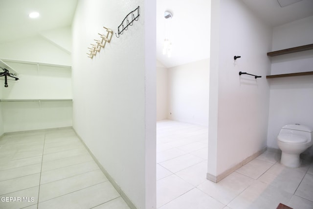 1465 Fito Hernandez St, El Paso, TX 79928 - bathroom with tile patterned flooring and vaulted ceiling