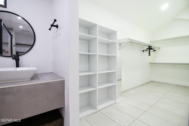 1465 Fito Hernandez St, El Paso, TX 79928 - walk in closet featuring tile patterned flooring and lofted ceiling