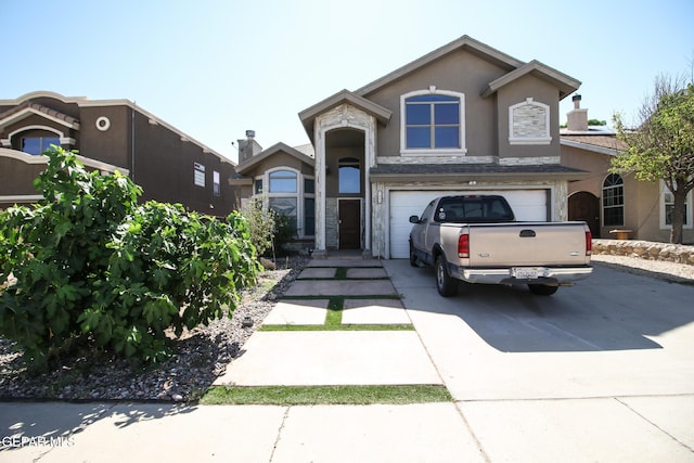 1465 Fito Hernandez St, El Paso, TX 79928 - view of front of property featuring driveway, stucco siding, an attached garage, and stone siding