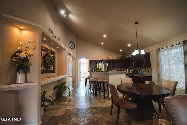 11344 Acoma St, El Paso, TX 79934 - dining room with stone tile flooring, recessed lighting, and high vaulted ceiling