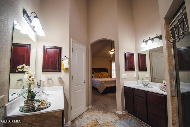 11344 Acoma St, El Paso, TX 79934 - bathroom with vanity, ensuite bathroom, a ceiling fan, and a towering ceiling