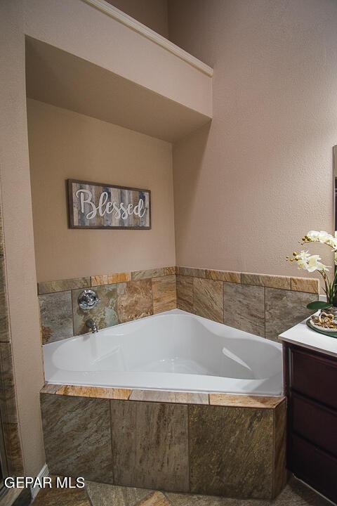 11344 Acoma St, El Paso, TX 79934 - bathroom featuring a bath and vanity