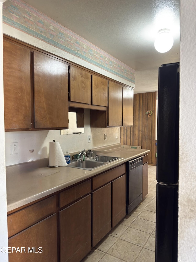 3376 Guthrie St, El Paso, TX 79935 - kitchen featuring freestanding refrigerator, dishwasher, and light countertops