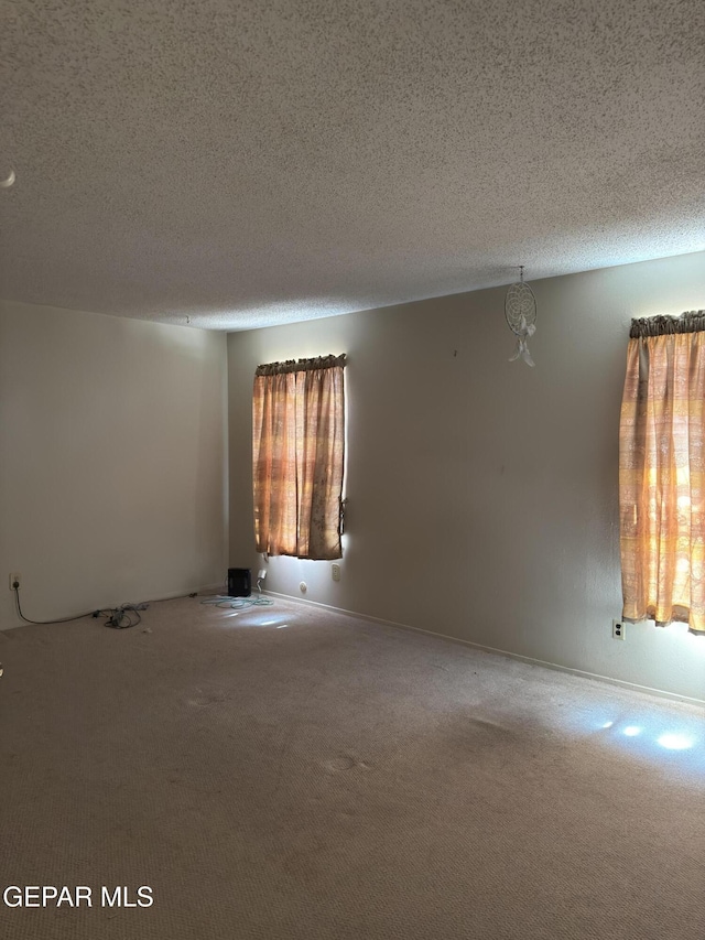 3376 Guthrie St, El Paso, TX 79935 - carpeted empty room with a textured ceiling