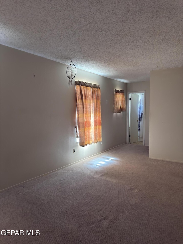 3376 Guthrie St, El Paso, TX 79935 - unfurnished room with carpet flooring and a textured ceiling
