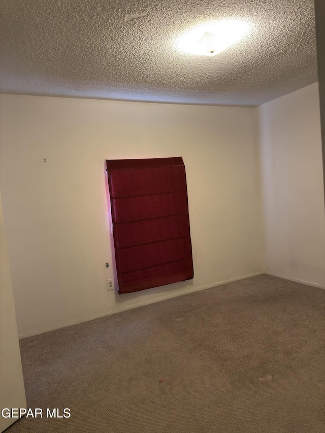 3376 Guthrie St, El Paso, TX 79935 - unfurnished room featuring carpet and a textured ceiling
