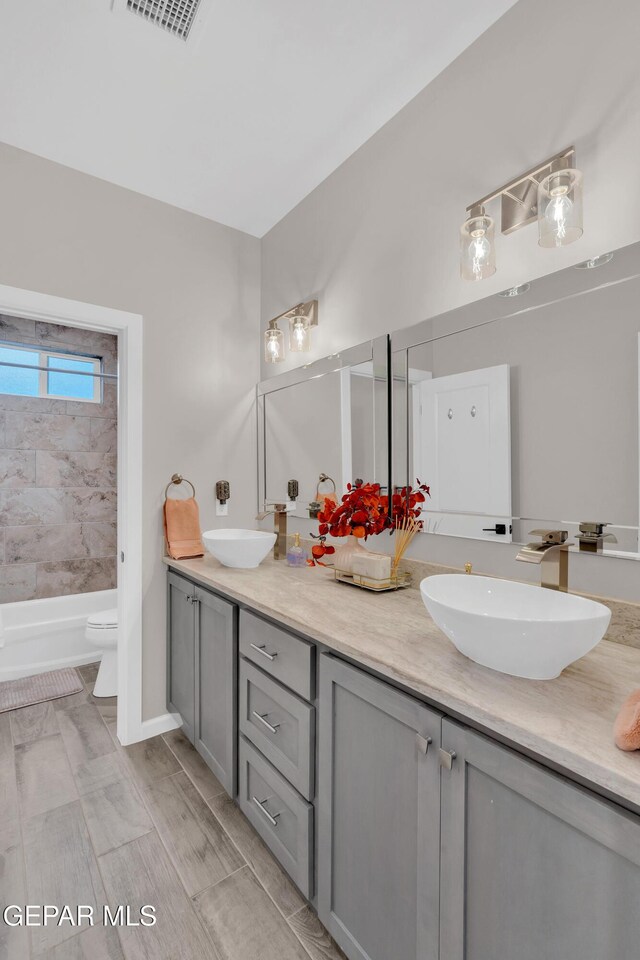 737 Al Smith Ln, El Paso, TX 79932 - bathroom featuring double vanity and shower / tub combination